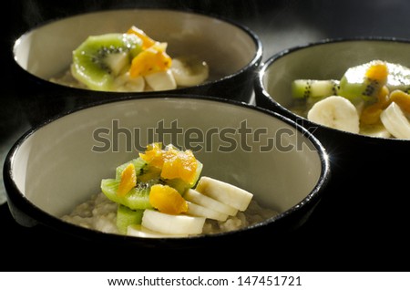 Hot porridge bowls served for breakfast in a cold winter morning.