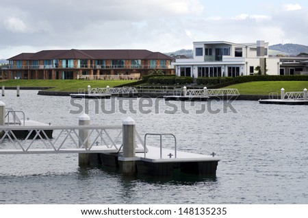 WHANGAREI,NZ - JULY 28:Luxury houses at the marine village of Marsden Cove Marina on July 28 2013.Marsden Cove is developing to a marine township and when complete will provide almost 1000 homes.