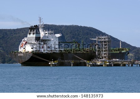 WHANGAREI,NZ - JULY 28:Tanker unloading at Marsden Point Oil Refinery on July 28 2013.It\'s produces 70% of NZ refined oil needs, with the rest being imported from Singapore, Australia and South Korea