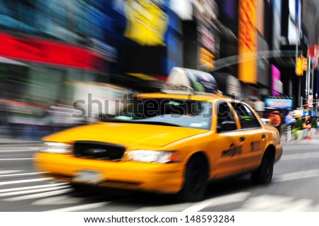 NEW YORK CITY - OCT 15: New York yellow cab in Time Square on October 15, 2010.It\'s one of the world\'s busiest pedestrian intersections and a major center of the world\'s entertainment industry.