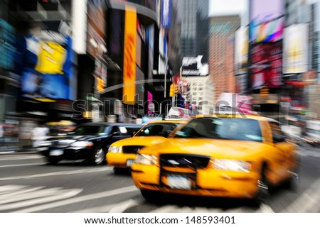 NEW YORK - OCT 15: New York yellow cabs race through Time Square on October 15, 2010.It\'s one of the world\'s busiest pedestrian intersections and a major center of the world\'s entertainment industry.