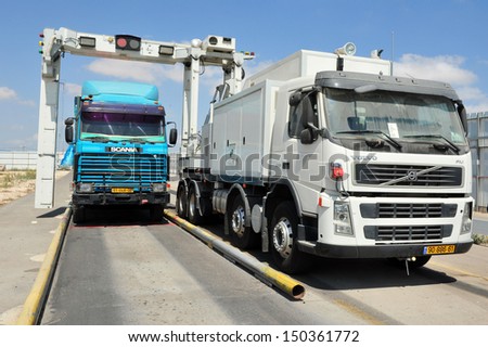 KEREM SHALOM, ISR - AUG 25:Truck full of goods to Gaza passing an X-Ray exam on Aug 25 2010.Since 2010, NIS 75M been invested to upgrade the crossing, which is capable of handling 450 trucks a day.