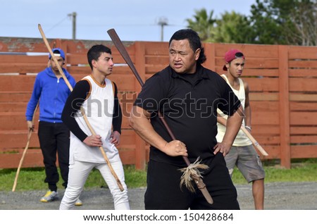 KAITAIA, NZ - AUG 15:Maori chief teach young men Mau Rakau martial art on Aug 15 2013.It\'s  ancient Maori martial art that teaches the use of the Taiaha and other Maori weapons in face to face combat.