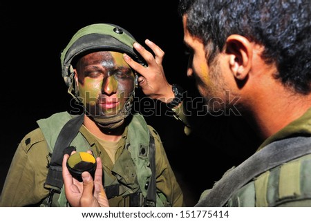 TZEELIM - NOV 09:Israeli special forces put face paint on March 31 2011.Since the beginning of history camouflage used to protect military equipment as well as individual soldiers and their positions.