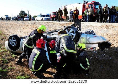 ASHKELON, ISRAEL - FEBRUARY 1: Firefighters in a deadly car accident scene on Feb 01 2009.According to the World Health Organization:1.2M people are killed in traffic accidents each year around the world