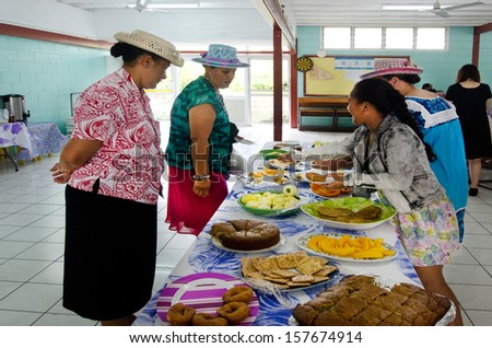 RAROTONGA - SEP 16:Cook Islands woman serve traditional food on sunday morning tea at CICC church on Sep 16 2013.The dominant religion in Cook Islands is Christianity since 1821.