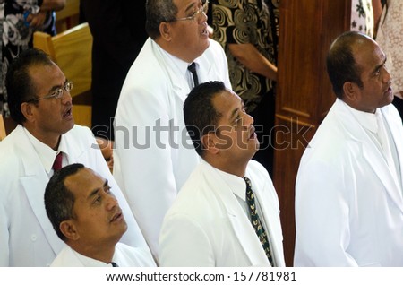 RAROTONGA - SEP 16:Cook Islander men pray at CICC church on Sep 16 2013.94% of Cook Islanders associated themselves with a faith.The Cook Islands Christian Church dominant with 49% (7,356) members