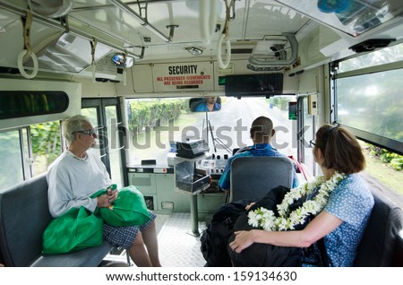 RAROTONGA - SEP 17:Passengers travel by the Cook Islands public bus on Sep 17 2013.The round-Rarotonga bus service runs clockwise and anti-clockwise on the main 32km  ring road around Rarotonga Island