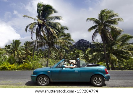 RAROTONGA - SEP 16:Tourists drive a rented car on Sep 16 2013.All tourists need a Cook Islands driving licence (NZ$20) valid one year from the police headquarters in Avarua Rarotonga Cook Islands.