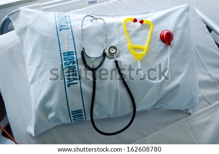 Doctors stethoscope and children stethoscope on hospital pillow in hospital bed.Concept photo