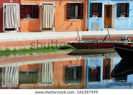 BURANO ISLAND , ITALY - MAY 01:Colorfully painted houses In Burano island, near Venice Italy on May 01 2011.Burano Island  is known for its small, colorful painted houses, popular with artists.