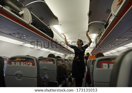 AUCKLAND - JAN 12:Flight attendant on Jan 12 2013. For planes with up to 19 passenger seats, no flight attendant is needed. For larger planes, one flight attendant per 50 passenger seats is needed.