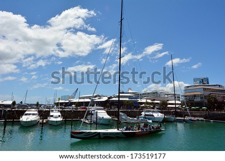 AUCKLAND, NZ - JAN 02:Visitors sail on Emirates Team New Zealand sail boat on Jan 02 2014.Team New Zealand is a sailing team based in Auckland, NZ representing the Royal New Zealand Yacht Squadron.