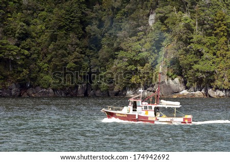 MILFORD SOUND,NZ - JAN 14:Fishing boat on Jan 14 2014.Southland has the largest rock lobster (crayfish) fishery in NZ, currently returning more than $30 million in annual exports, mostly to Hong Kong.