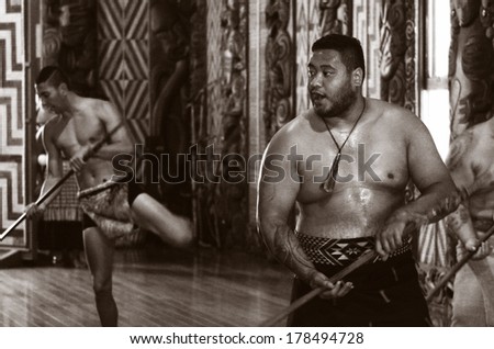WAITANGI, NZ - FEB 06:Maori men sing and dance during Waitangi Day on February 6 2014 in Waitangi NZ.It\'s a New Zealand public holiday to celebrate the signing of the Treaty of Waitangi in 1840. (BW)