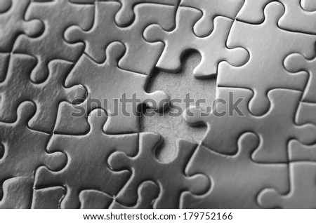 Missing jigsaw puzzle piece. Business concept for completing the final puzzle piece (BW)