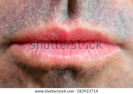 Man lips. full frame close up. Concept photo of male sexuality and skin medical care.