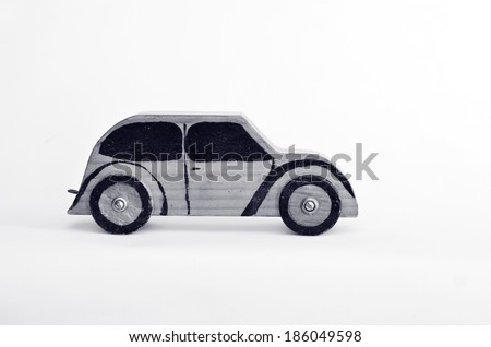 Toy car isolated on white background with copy space.Concept photo of car business, car Insurance, auto dealership,car rental ,safe driving ,buying, renting, fuel, service and repair costs (BW)