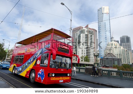 MELBOURNE - APR 11 2014:Visitors on Melbourne tour bus.It circle around the capital state of Victoria and the second most populous city in Australia show tourist the unique landmarks and history.