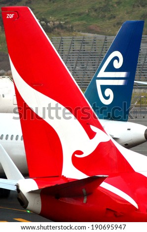 AUCKLAND - APR 10 2014:Air New Zealand and Qantas planes in Auckland International Airport.In 2006, Air New Zealand and Qantas signed a code-share agreement for their trans-Tasman routes.