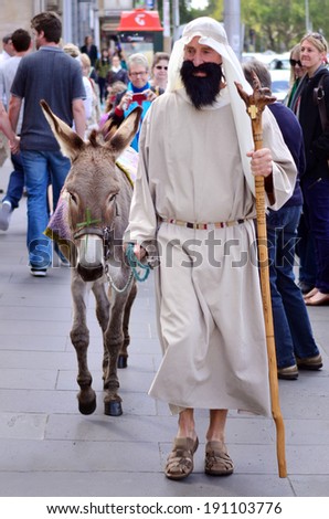 MELBOURNE - APR 13 2014:Men dress up as Jesus during Easter holiday.Easter is linked to the Jewish Passover by much of its symbolism, as well as by its position in the calendar.