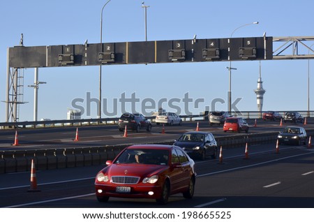 AUCKLAND,NZ - MAY 27 2014:Traffic on Auckland Harbor Bridge in Auckland, New Zealand.The daily average number of cars crossing the Auckland Harbour Bridge is presently around 165,000
