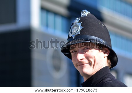 AUCKLAND - JUNE 01 2014:New Zealander dressed as a British Police Officer celebrate the Queen\'s Birthday on first Monday of June each year as the Queen of the United Kingdom being the head of state
