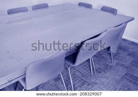 Empty meeting conference table with natural light. Concept photo of business workplace.