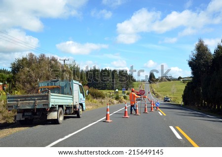 TAIPA, NZ - APR 01 2014:Fulton Hogan roadwork.Fulton Hogan is a large infrastructure construction, roadworks company in NZ and Australasia.In 2013 it\'s annual operating profit was NZ$96.5 million.