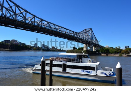 BRISBANE, AUS - SEP 26 2014:Ferry boat sail under The Story Bridge.It\'s the longest cantilever bridge in Australia, spanning the Brisbane River in Brisbane Queensland, Australia.
