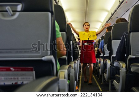 AUCKLAND - SEP 22 2014:Flight attendant. For planes with up to 19 passenger seats, no flight attendant is needed. For larger planes, one flight attendant per 50 passenger seats is needed.