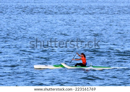 GOLD COAST - OCT 08 2014:Australian woman sea kayaking.It\'s a very popular sport in the waterway of the Gold Coast in Queensland, Australia.