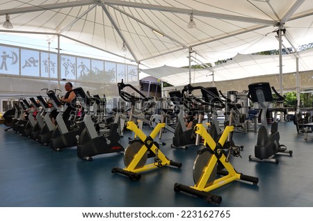 Gold COAST - OCT 09 2014:Modern gym interior with equipment.A new study by Kettler found that 50 per cent of the people that go to gym goers only to check out the opposite sex or meet with friends.