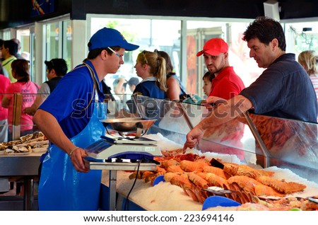 GOLD COAST - OCT 05 2014:Tourist and Australians buys sea food in Charis Seafood. It's one of the most famous and largest seafood outlets in the Gold Coast Queensland, Australia.