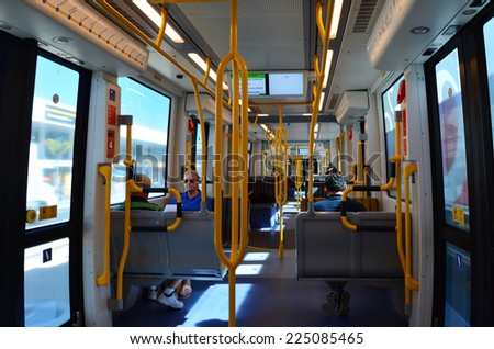GOLD COAST, AUS - OCT 17 2014:Passengers on the Gold Coast Light Rail G in Gold Coast Queensland, Australia.The line opened on July 2014 and it 13 Km (8.1 mi) long.