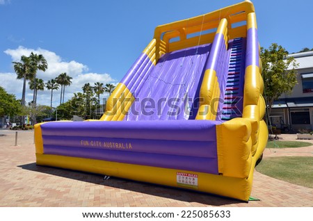 GOLD COAST - OCT 19 2014:Big slide bouncy Castle..In 2001 U.S. Consumer Product Safety Commission outline the dangers and recommended safety precautions for operating an inflatable structure.