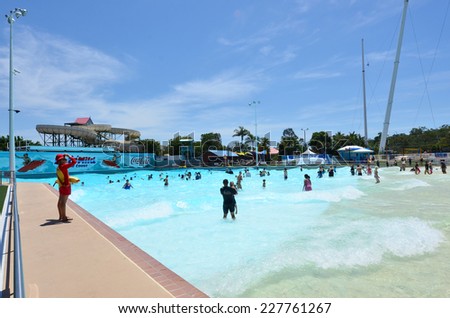 GOLD COAST, AUS - OCT 30 2014:Visitors in Giant Wave Pool at Wet\'n\'Wild Gold Coast water park. In 2009, the park received 1,095,000 visitors ranking it first in Australia and eighth in the world