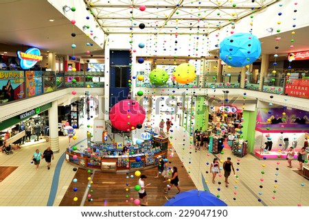 SURFERS PARADISE - SEP 30 2014:Visitors in Surfers Paradise Center.It one of Australia\'s iconic coastal tourist destinations, drawing about 10 million tourists every year from all over the world.
