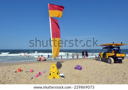 GOLD COAST, AUS - NOV 02 2014:Australian Lifeguards in Surfers Paradise, Australia.They are world-renown for their high levels of skill and knowledge in accident prevention and rescue response