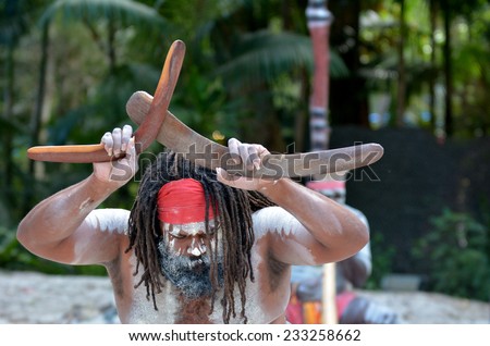 Yugambeh Aboriginal man holds boomerangs during Aboriginal culture show in Queensland, Australia.