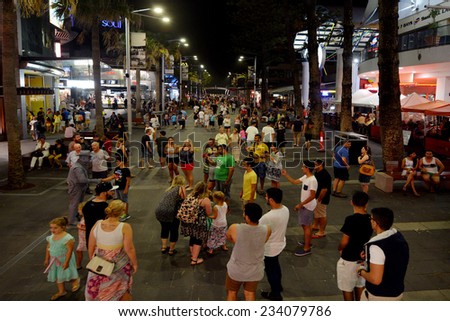 SURFERS PARADISE - NOV 15 2014:Visitors in Cavill Avenue Surfers Paradise CBD at night.It\'s Australia\'s iconic coastal tourist destinations drawing 10 million tourists a year from all over the world.