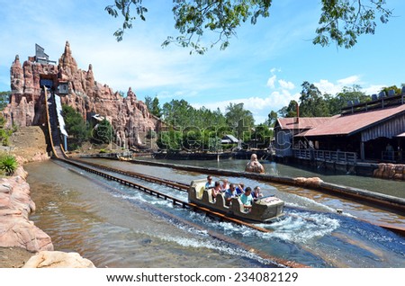 GOLD COAST, AUS -  NOV 06 2014:Visitors ride on Wild West Falls Adventure Ride in Movie World Gold Coast Queensland Australia.It\'s an 8-seater flume ride with the largest drop of its kind in Australia