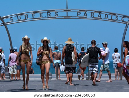 SURFERS PARADISE - NOV 15 2014Meter Maids and surfers under surfers paradise arch.It\'s Australia\'s iconic coastal tourist destinations drawing 10 million tourists a year from all over the world.
