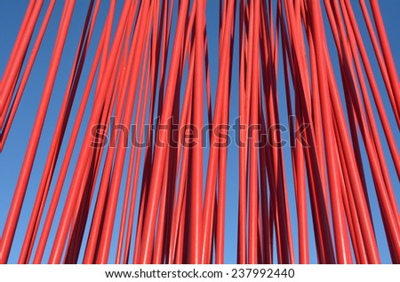 Red metal poles. Abstract texture background.