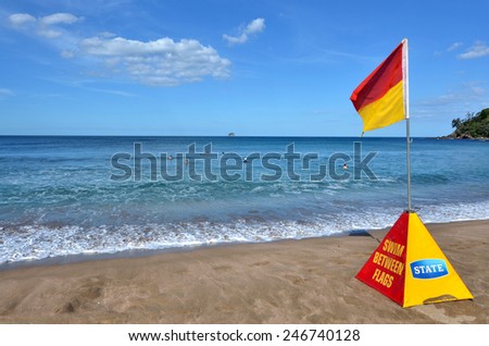 WHITIANGA, NZL - Jan 20 2015:Red yellow flag. NZL Government urge to stump up Lifesavers and Coastguard operations, as 2013 OECD report show NZ has the 3rd highest drowning rate in the developed world
