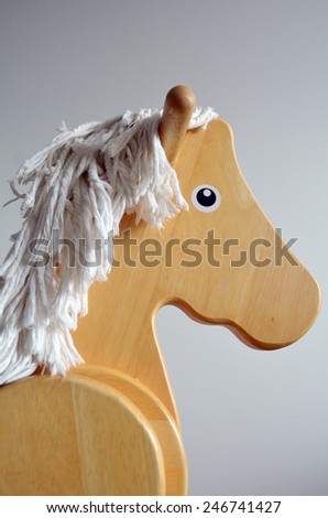 Wooden Rocking Horse face. Childhood concept. copyspace
