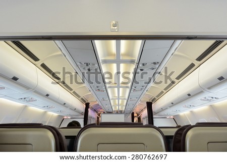 Commercial passengers airplane interior of rows of chairs. concept photo copy space