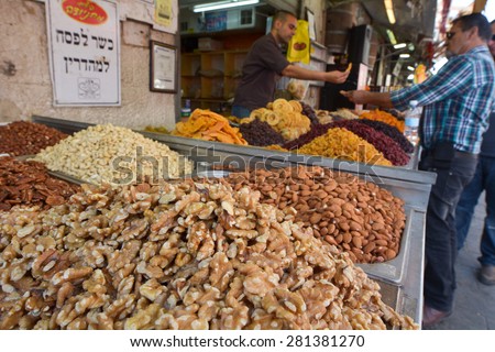 JERUSALEM - MAR 25 2015:Edible seeds on display in Mahane Yehuda Market in Jerusalem, Israel.Seeds are the source of some medicines including castor oil, tea tree oil and the cancer drug, Laetrile.