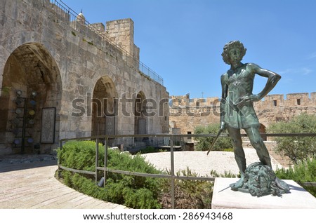 JERUSALEM - MAY 05 2015:David and Goliath sculpture at the Tower of David and archeological garden in Jerusalem, Israel.It\'s a famous landmark of Jerusalem with historical significant.