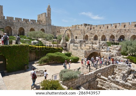 JERUSALEM - MAY 05 2015:Visitors at the Tower of David and archeological garden in Jerusalem, Israel.It\'s a famous landmark of Jerusalem with historical and archaeological significant.